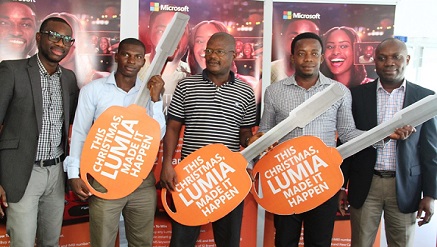 (L-r): Olumide Balogun, senior product manager, Microsoft Mobile Devices and Services, West and Central Africa, Dada Charles Adedayo; Chukwudi Anayo Onitsha; Emem Sunday; winners of the Lumia Christmas Promo first draw and Joseph Umunakwe, general manager, Microsoft Mobile Devices and Services, West Africa, during the presentation of their car keys on Wednesday at Microsoft Mobile Devices and Services Office in Lagos.